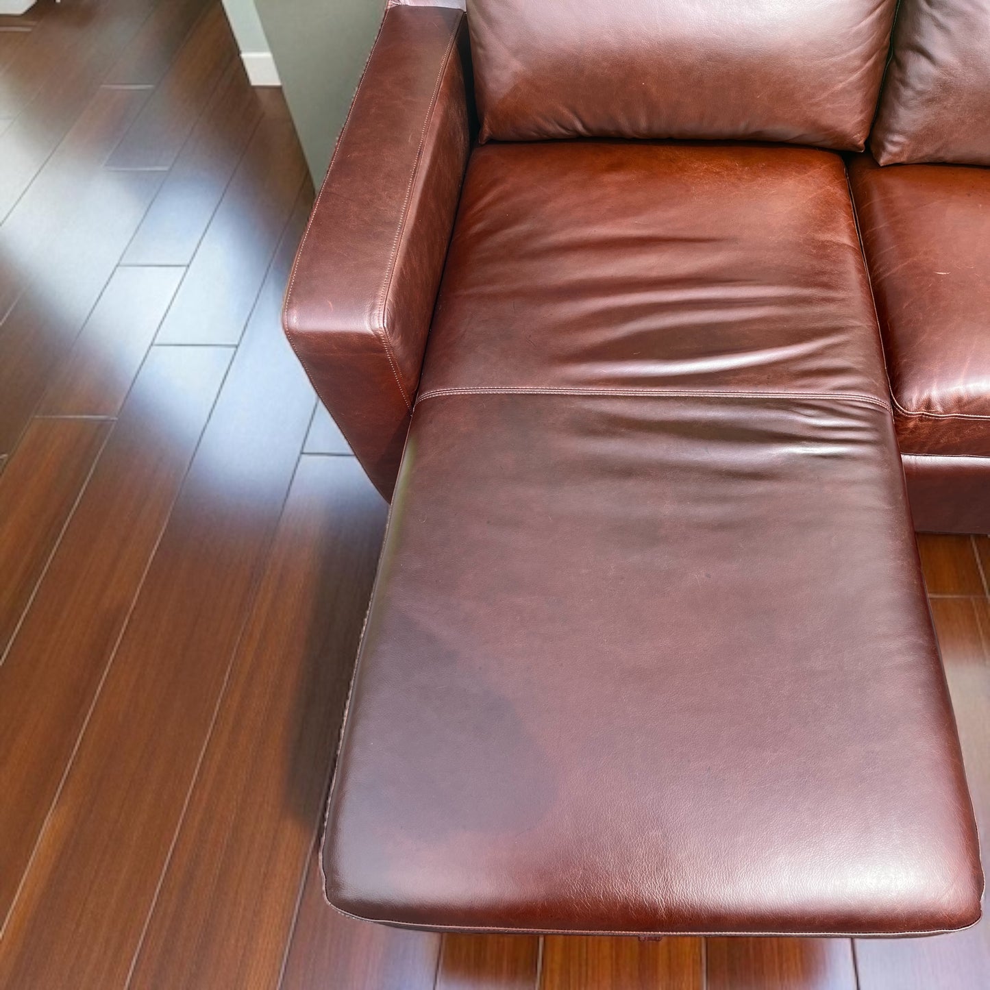 Interior Define Sloan Leather Chaise Sleeper Storage Sectional
